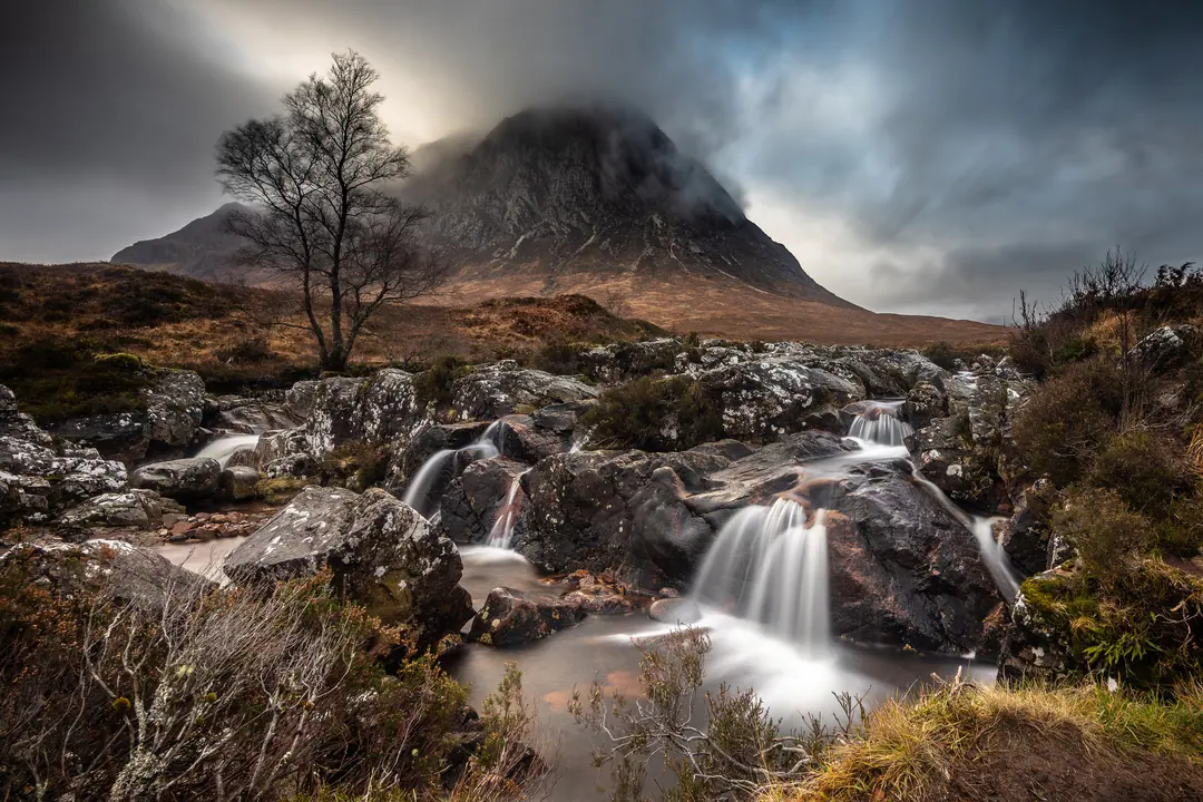 Waterfall beneath Buachaille Etive Mòr, Glencoe, under brooding cloud