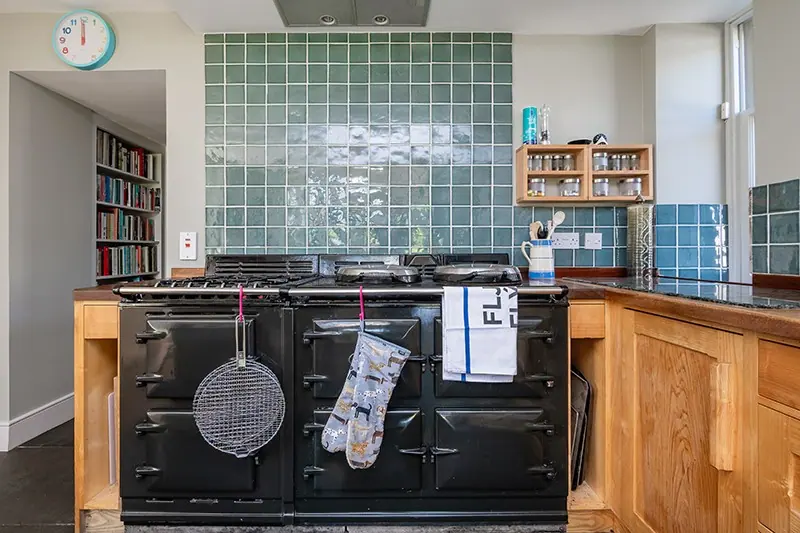 Kitchen with Aga and tiled splashback