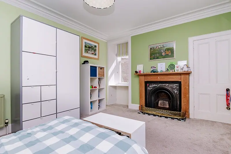Guest bedroom with fireplace