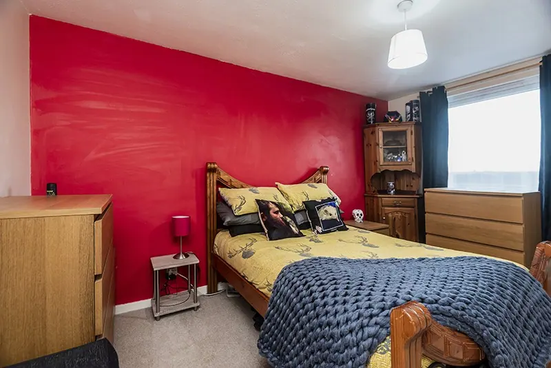 Bedroom with red feature wall