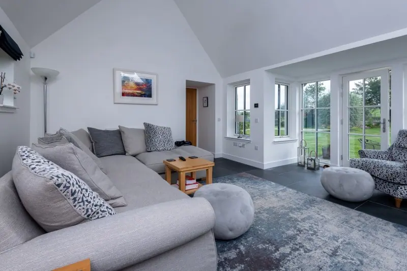 Bright living room with grey sofa