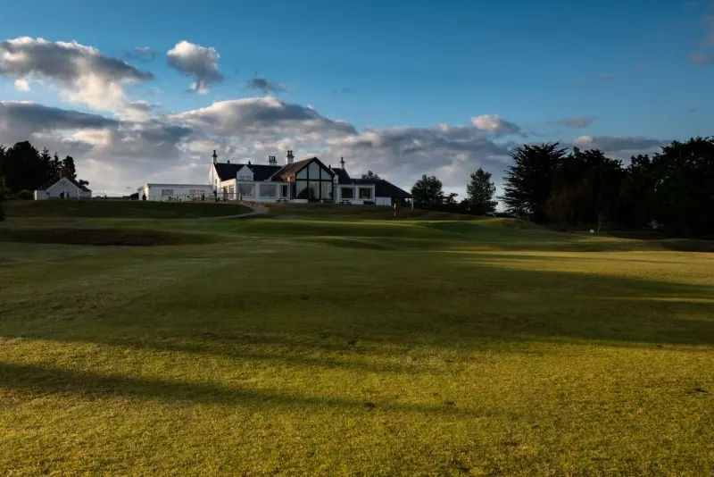 Golf course and clubhouse at golden hour
