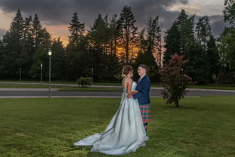 Couple on the lawn at sunset