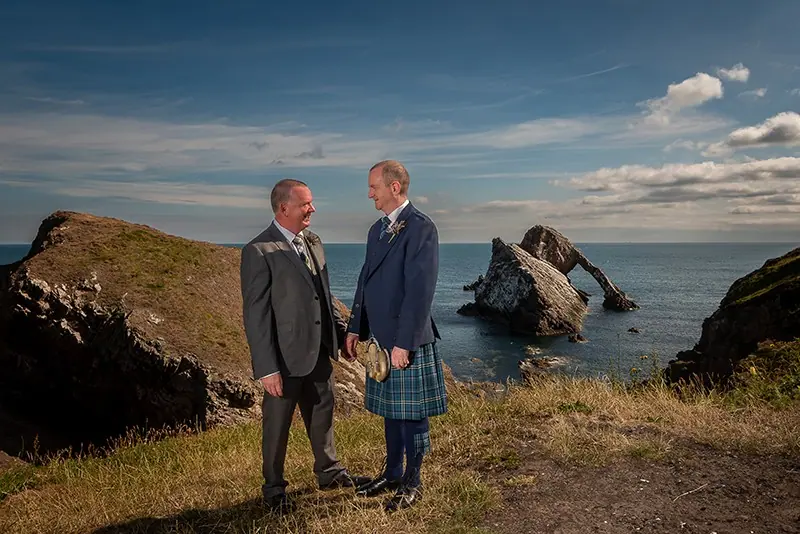 Couple on a rocky clifftop by the sea